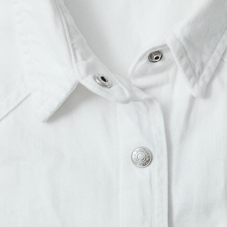 Close-up of a white dress shirt with buttons